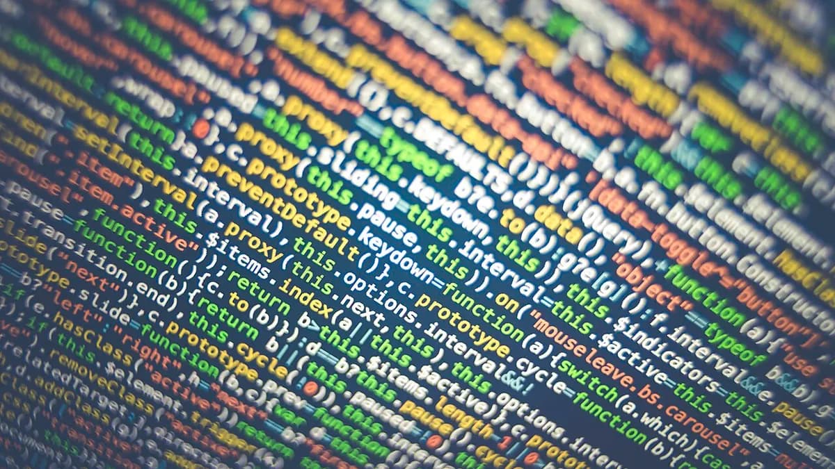 Close-up of colourful source code on a screen