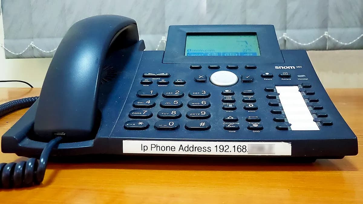 Blue office IP telephone on a desk