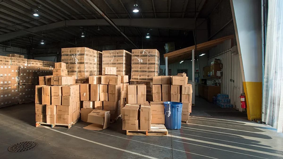 Pallets of stacked cardboard boxes in a warehouse